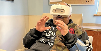 Veteran using virtual reality headset.