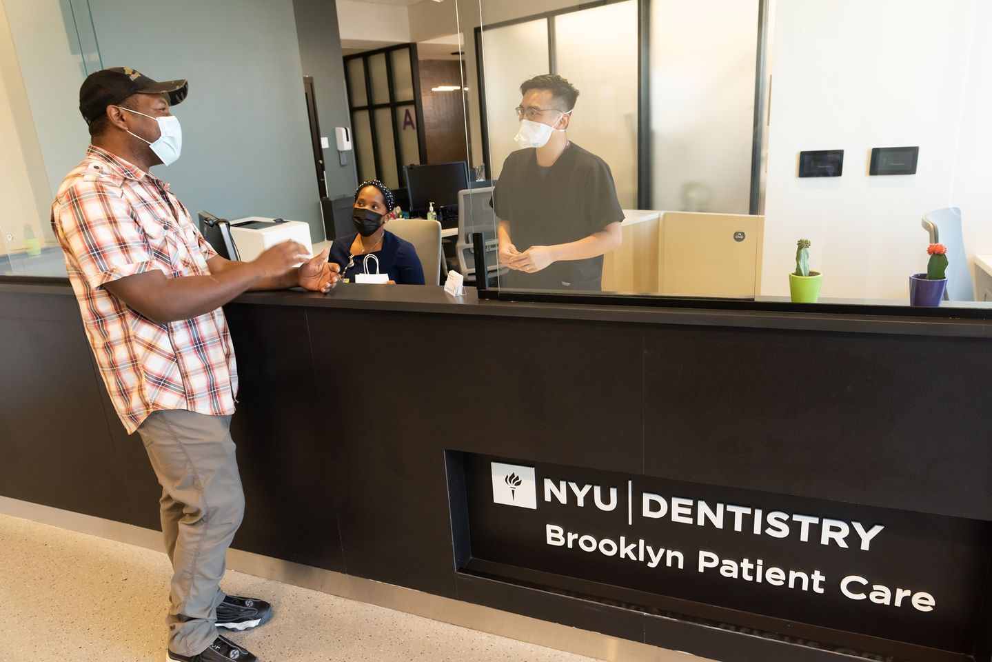 African American Male Veteran, NYU VetSmile Patient with DCP_Candid_front desk
