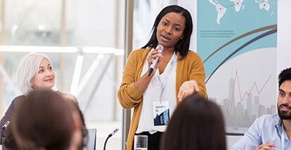 Photo of a woman speaking to group