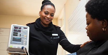 A VHA employee interacts with a patient