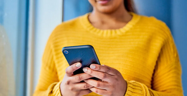 Compassionate Care Corps woman with phone; loneliness