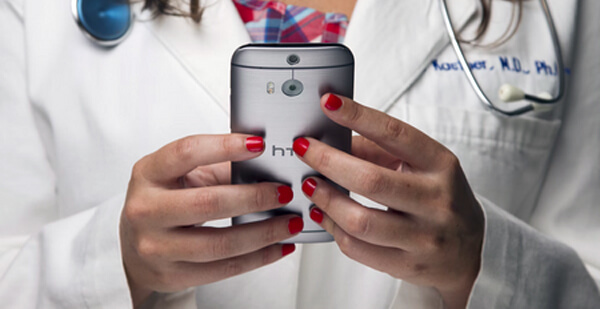 Photo of health practioner using mobile phone