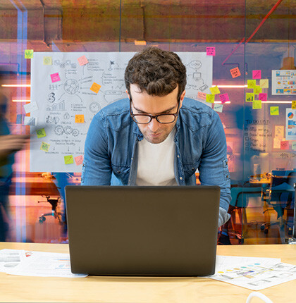 Photo of a man working on computer