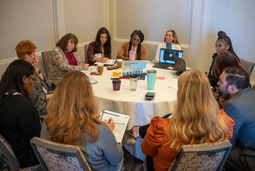 Image of people sitting around a table