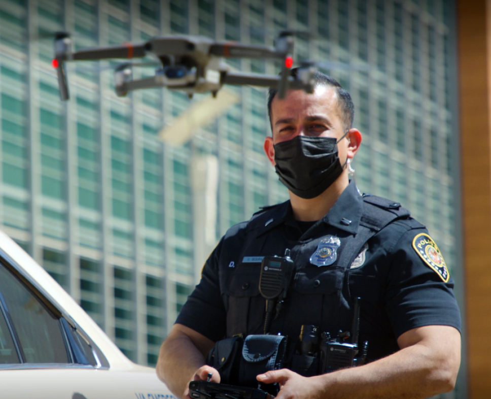 Police officer operating a drone for an emergency