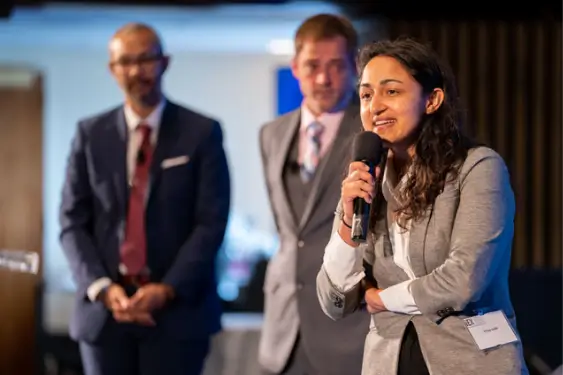 Fellows speaking at a convention